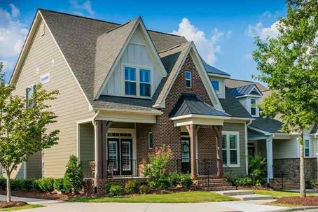 Nice house with shrubs and small trees around.