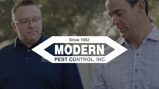 modern pest control logo over watermark image of technicians